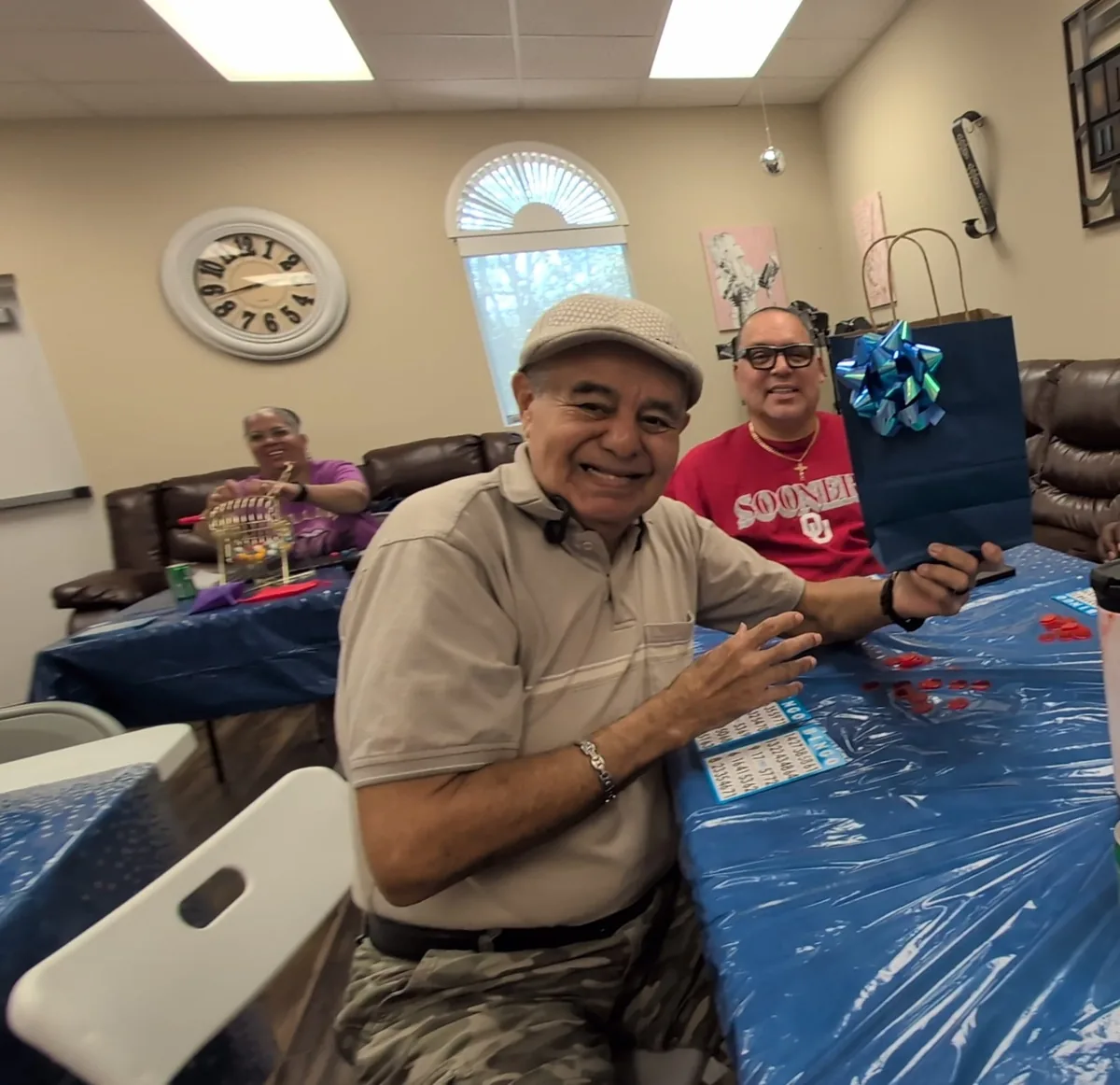 Members sharing smiles and conversation at a table